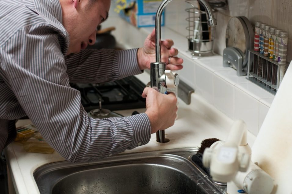 Man fixing a faucet
